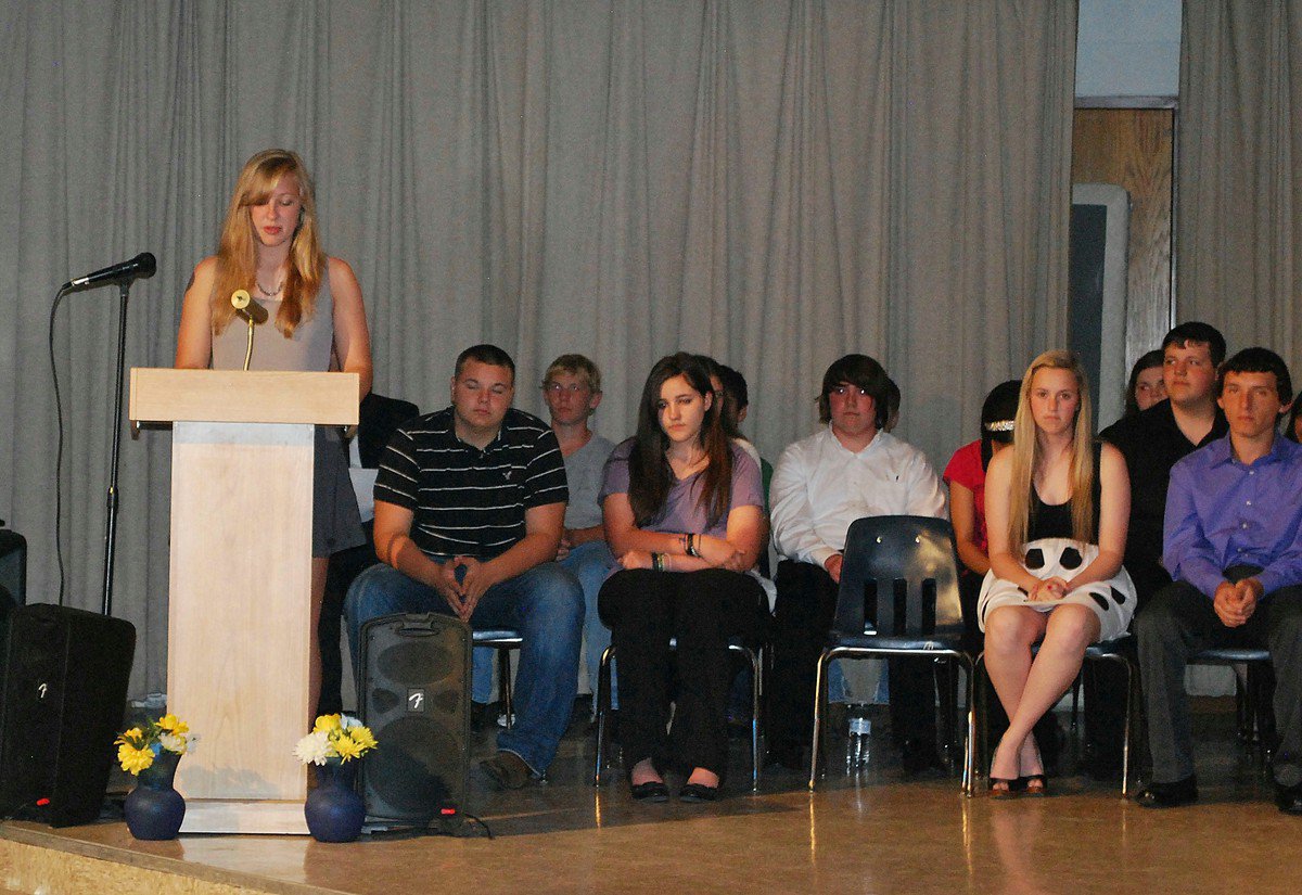 Image: Jaclynn Lewis reads a passage about service.