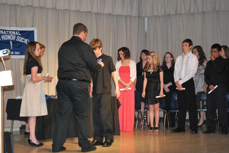 Image: Levi McBride receives his NJHS pin.