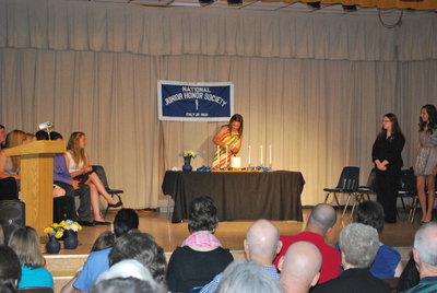 Image: Bailey Eubank lights the candles.