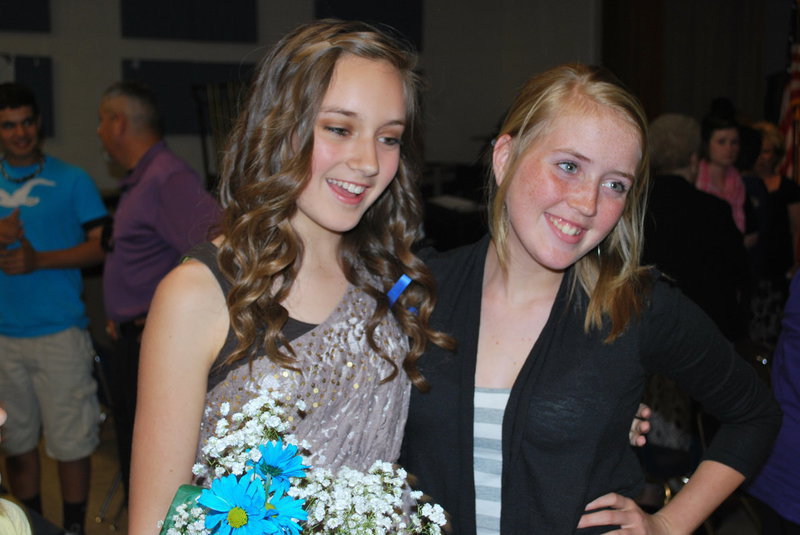 Image: Jozie is congratulated by classmate Hannah Washington