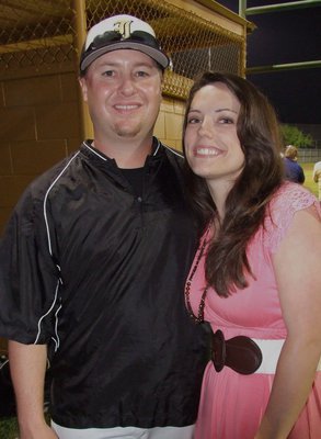 Image: Gladiator head coach, Josh Ward is congratulated by his fiance, Jessica Simon, after his team defeated Rio Vista, 10-5.