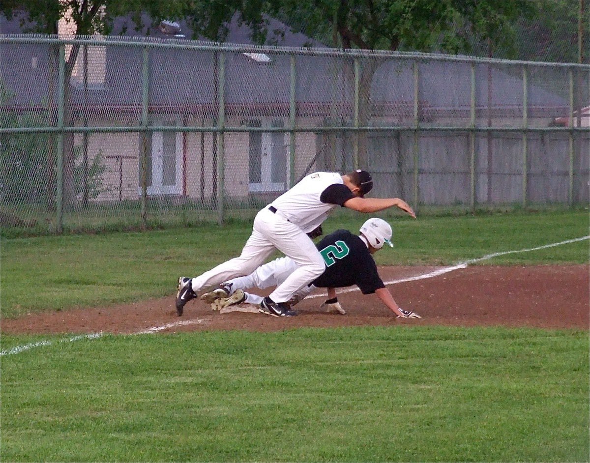 Image: Italy’s third baseman, Kyle Jackson(7), attempts to tag an Eagle runner before he lands but the call goes Rio Vista’s way.