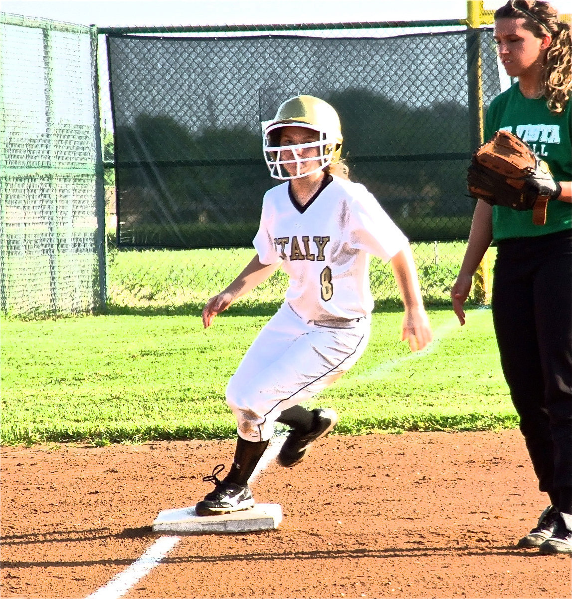 Image: Italy freshman, Tara Wallis(8) rounds third base looking for more.