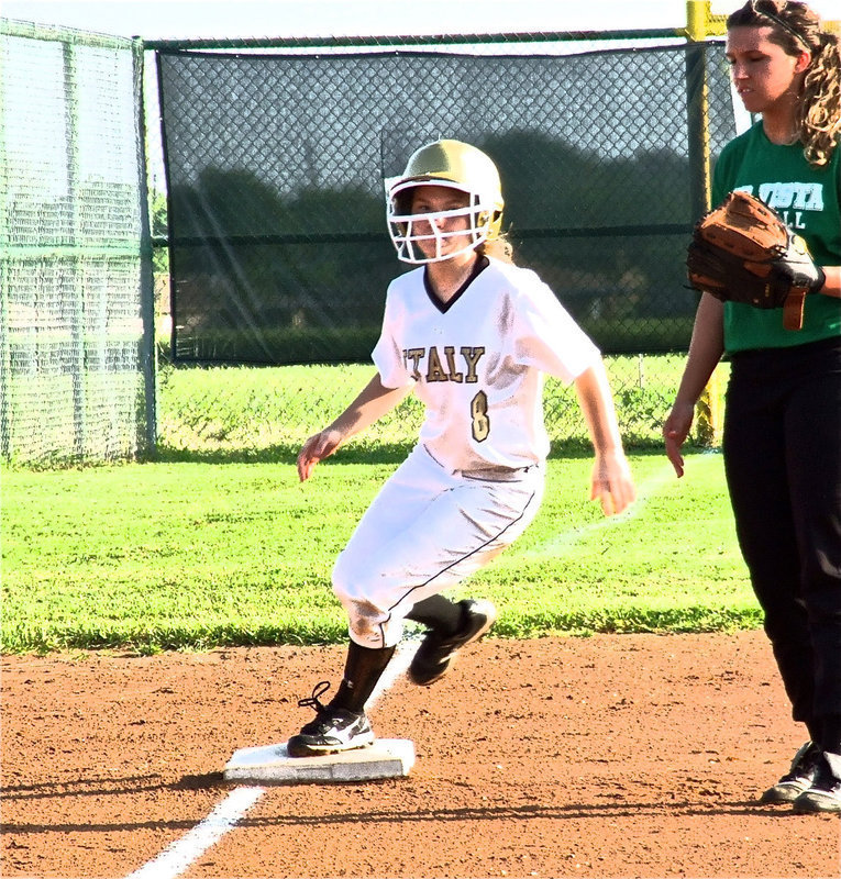 Image: Italy freshman, Tara Wallis(8) rounds third base looking for more.