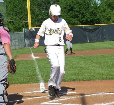 Image: Cody Boyd(9) scores a run for Italy’s JV.