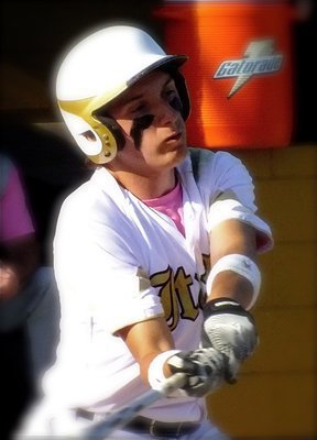 Image: Italy’s, Chace McGinnis(2) takes a swing at fighting cancer.