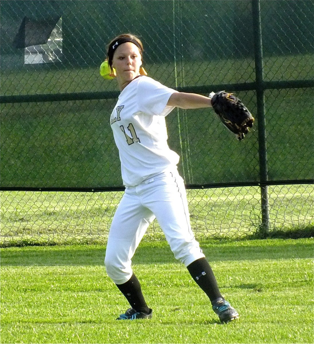 Image: Lady Gladiator left fielder Bailey Eubank(11) prepares to throw out the Lady Zebras.