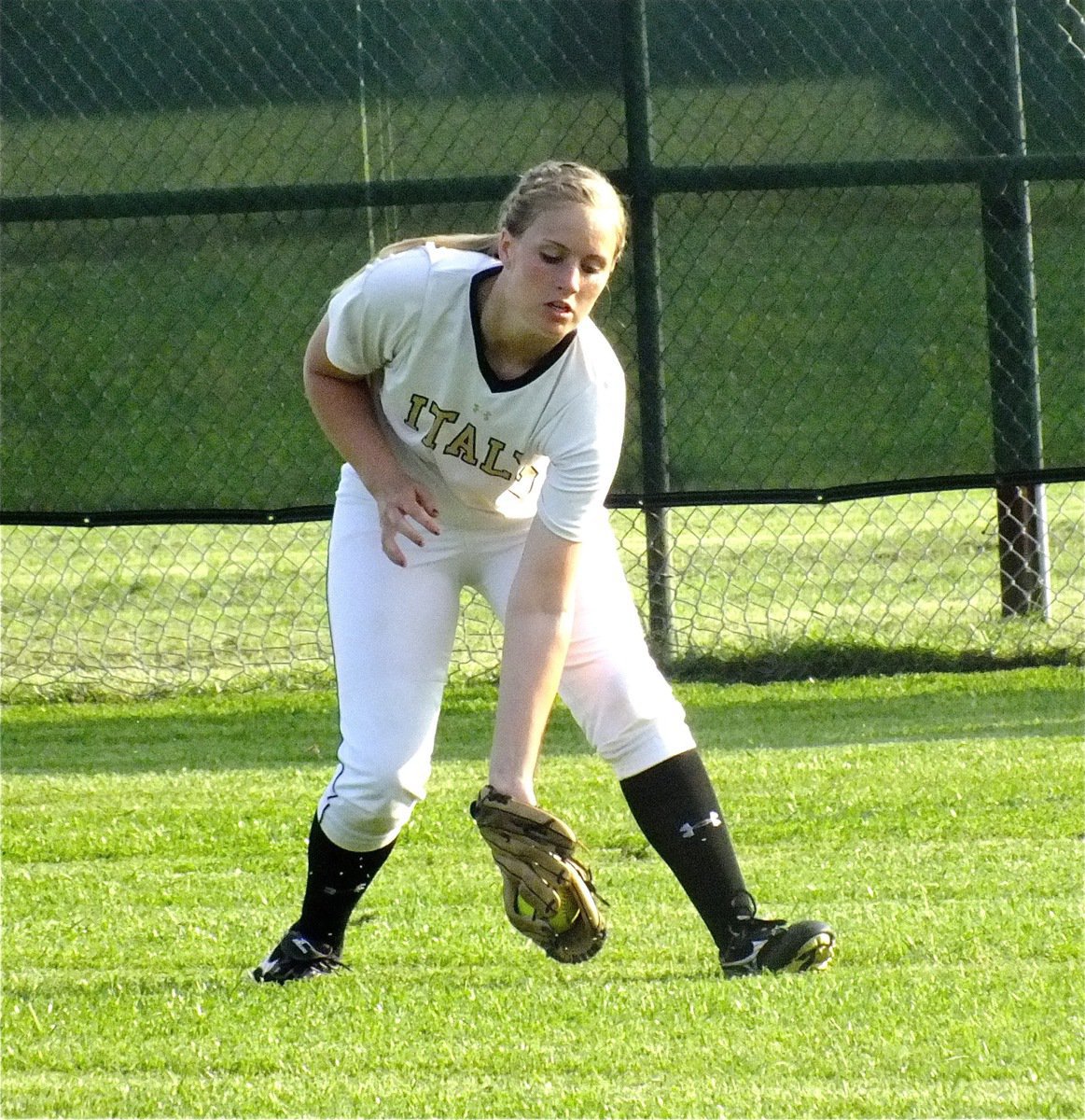 Image: Lady Gladiator center fielder, Madison Washington(2) fields a grounder.