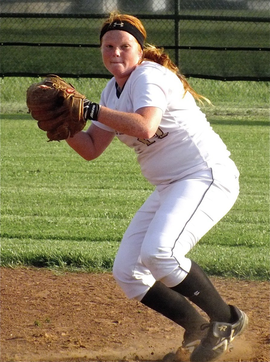 Image: On the hunt, Lady Gladiator third baseman, Katie Byers guns down a Lady Zebra.