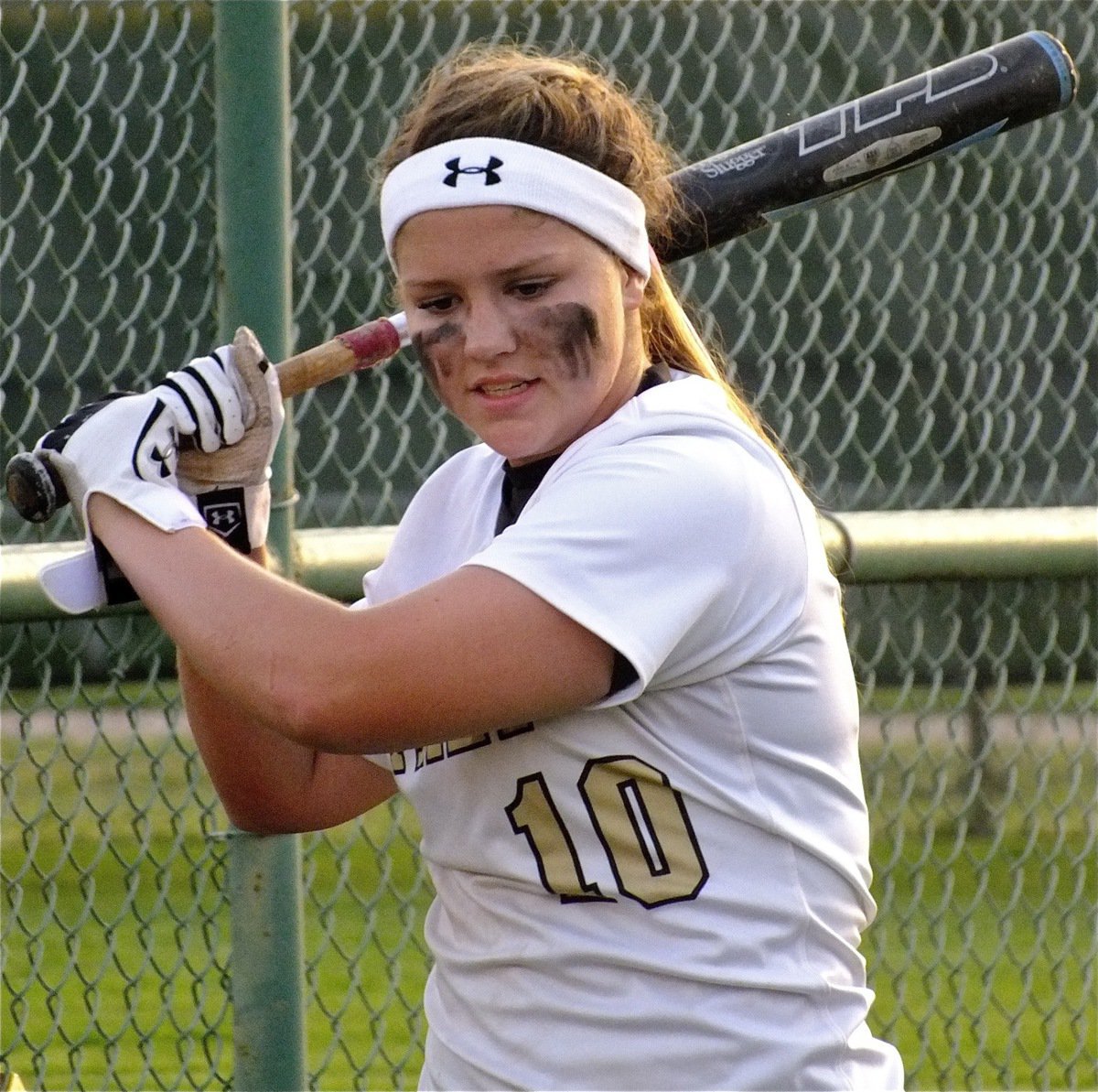 Image: Paige Westbrook takes extra swings during the game.