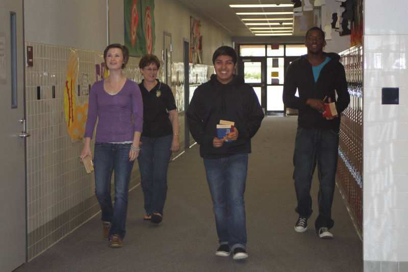 Image: Mrs. Sharon Farmer escorts the some of the journalism team members to their competition room.
(L-R) Meagan Hooker, Cruz Enriquez, Paul Harris