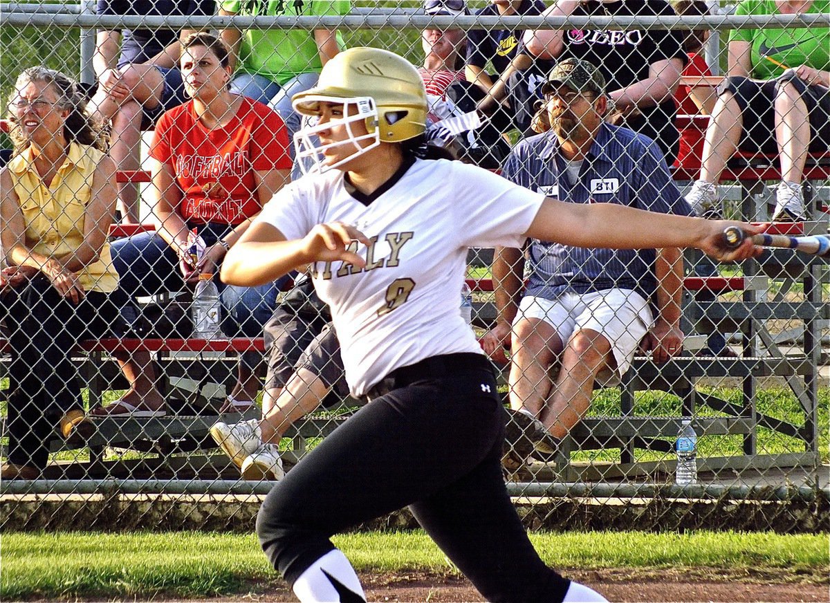 Image: Lady Gladiator, Alyssa Richards(9), aims for Maypearl’s red wall surrounding the outfield.