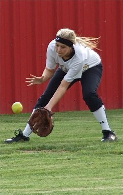 Image: Lady Gladiator, Kelsey Nelson, fields a ground ball during pre-game warmups.
