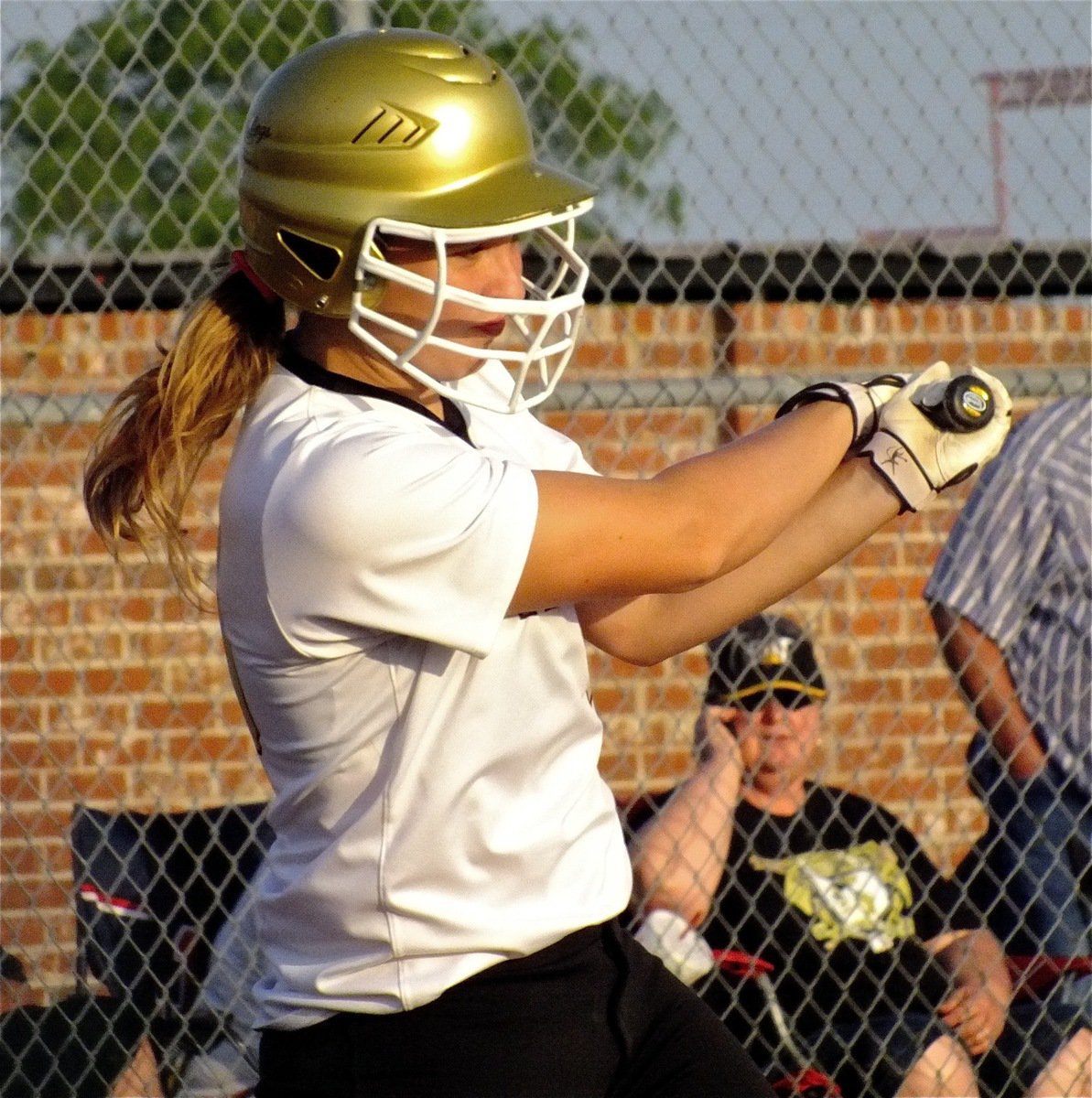 Image: Freshamn, Jaclynn Lewis, gets a hit against Maypearl.