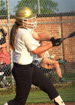 Image: Lady Gladiator, Madison Washington, drives the ball thru Maypearl’s defense.