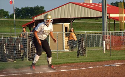 Image: Alyssa Richards, looks for an opportunity to steal home.