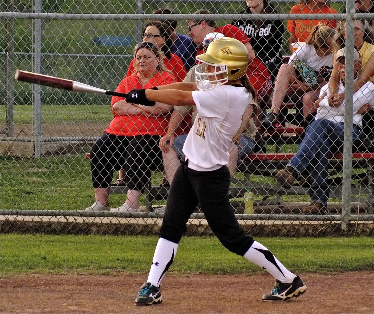 Image: Lady Gladiator, Bailey Eubank(11), takes a practice swing before stepping into the batter’s box.