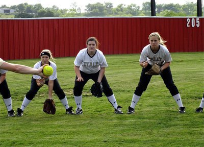 Image: Lady Gladiators, Kelsey Nelson, Bailey DeBorde and Madison Washington are trained to attack that yellow ball.