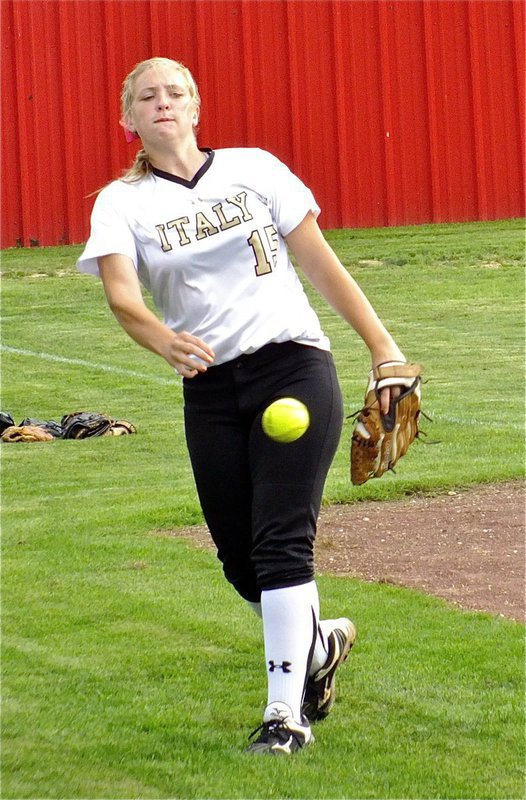 Image: Italy’s, Jaclynn Lewis, gets her arm ready for duty.