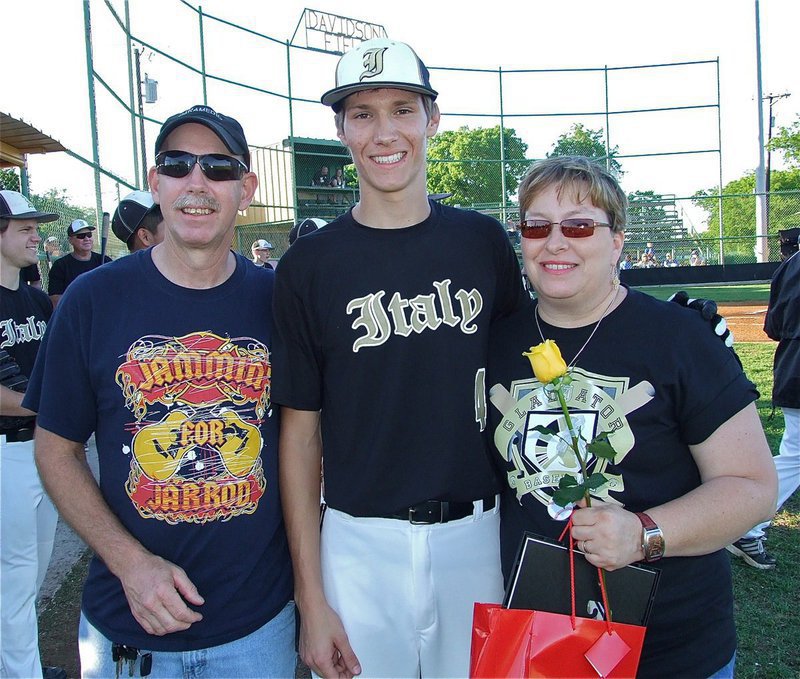 Image: Senior Gladiator, Alex DeMoss(4), is honored during, “Senior Day,” while being escorted by his parents, Anne &amp; Tommy Sutherland.