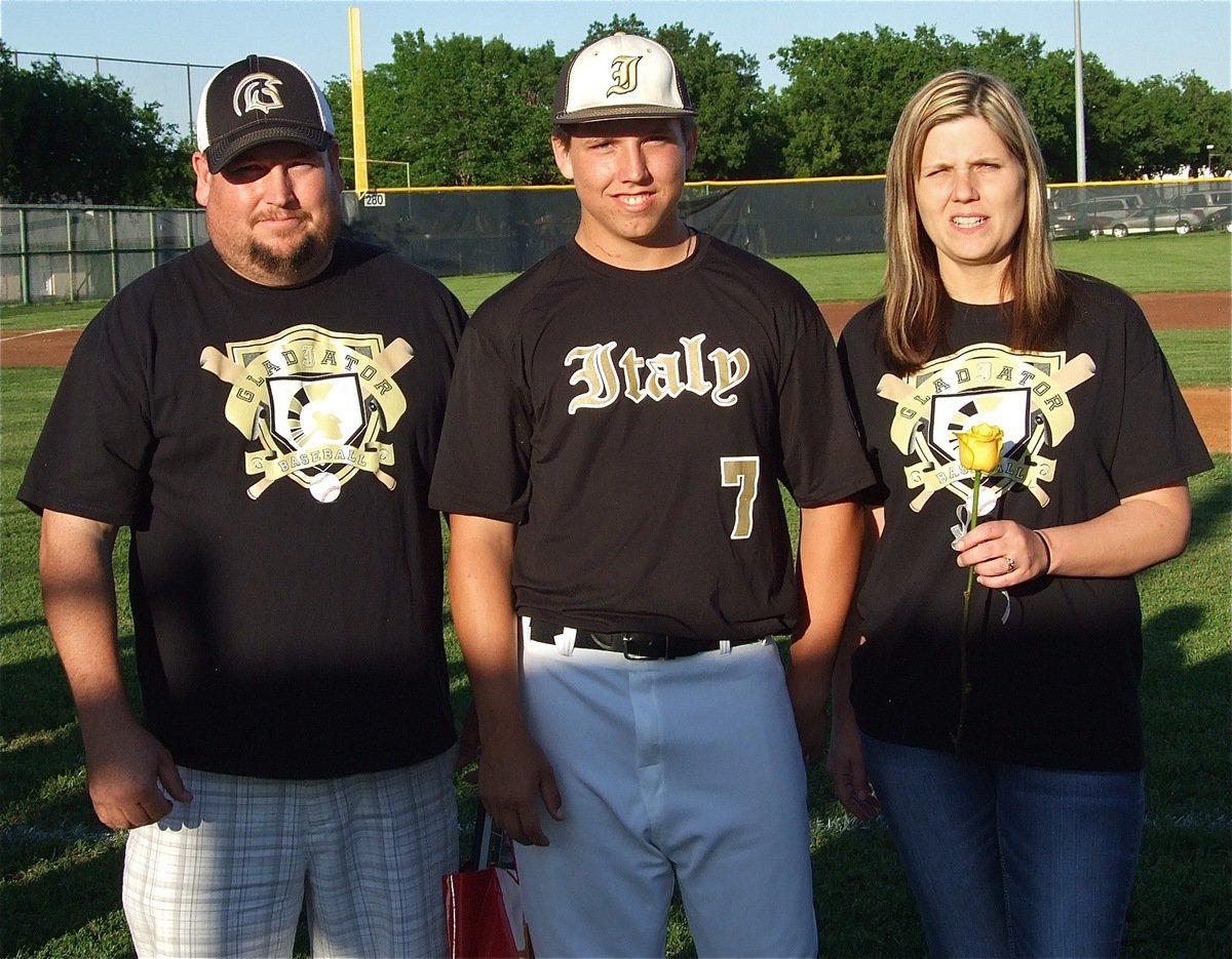 Image: Senior Gladiator, Kyle Jackson(7), is honored during, Senior Day," and is escorted by his parents, Gary &amp; Sabrina Jackson.