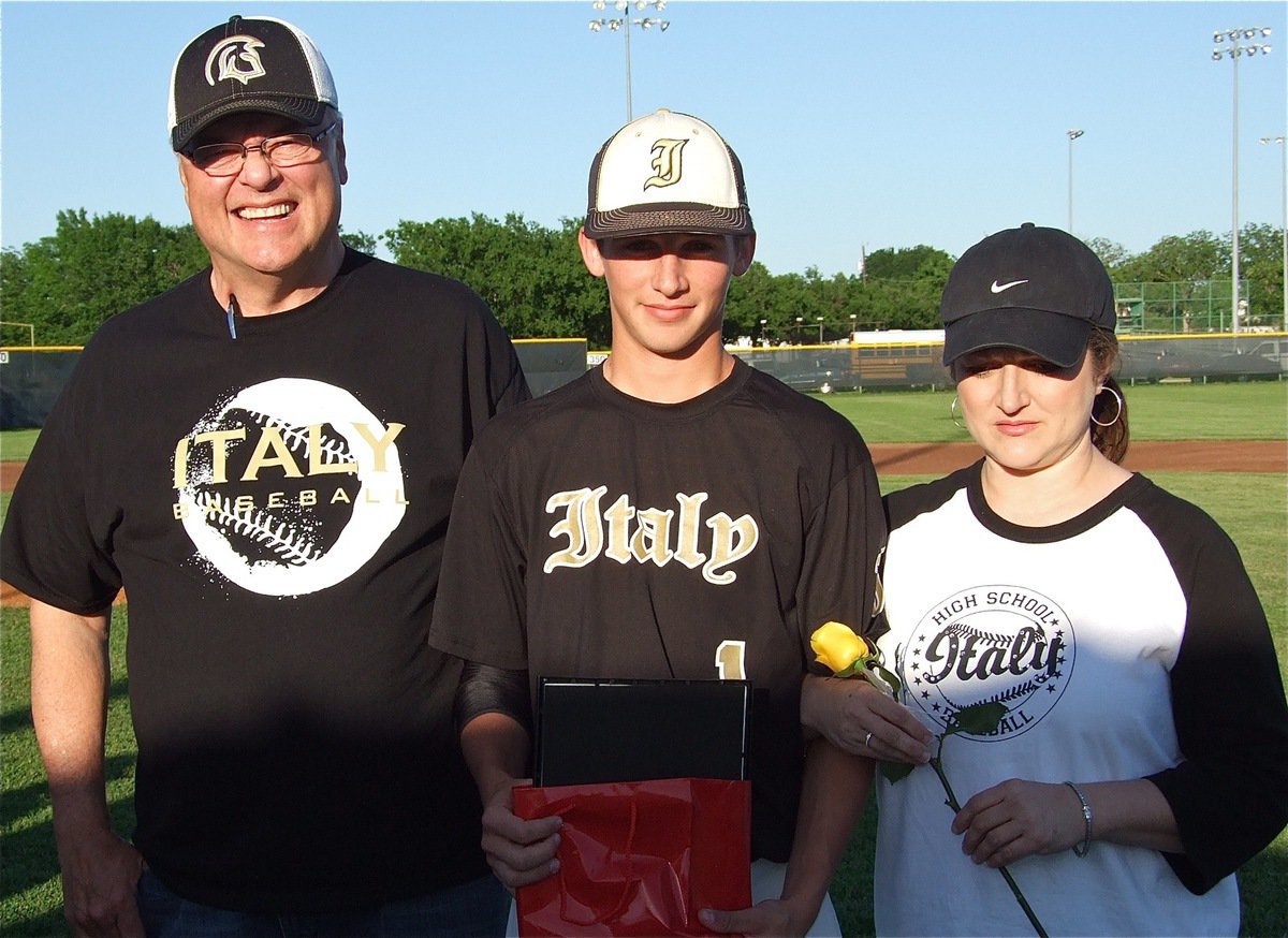 Image: Senior Gladiator, Ross Stiles(1), is honored during, “Senior Day,” and is escorted by his parents, Mark &amp; Clover Stiles.