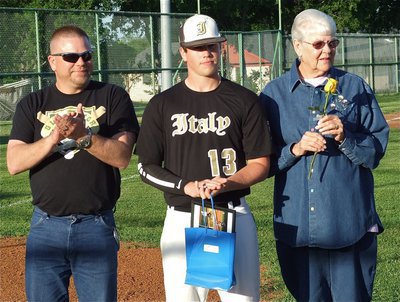 Image: Senior Gladiator, Justin Buchanan(13), is honored during, “Senior Day,” and is escorted by his father, Mark Buchanan, and his grandmother, Linda Buchanan.
