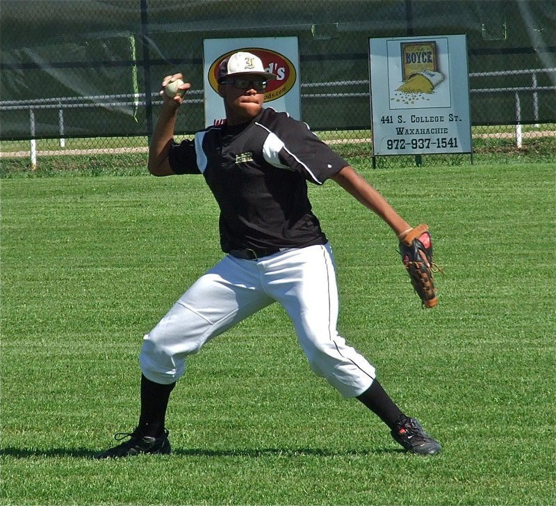 Image: JV Gladiator, John “Squirt” Hughes,  gets going in warmups.