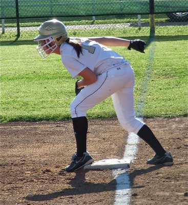 Image: Italy’s, Bailey Bumpus(18) is about to be a blur on the bases.