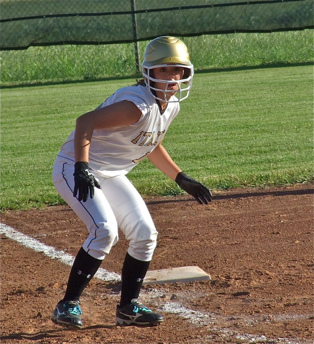 Image: Bailey Eubank(11) watches for a chance to reach home plate.