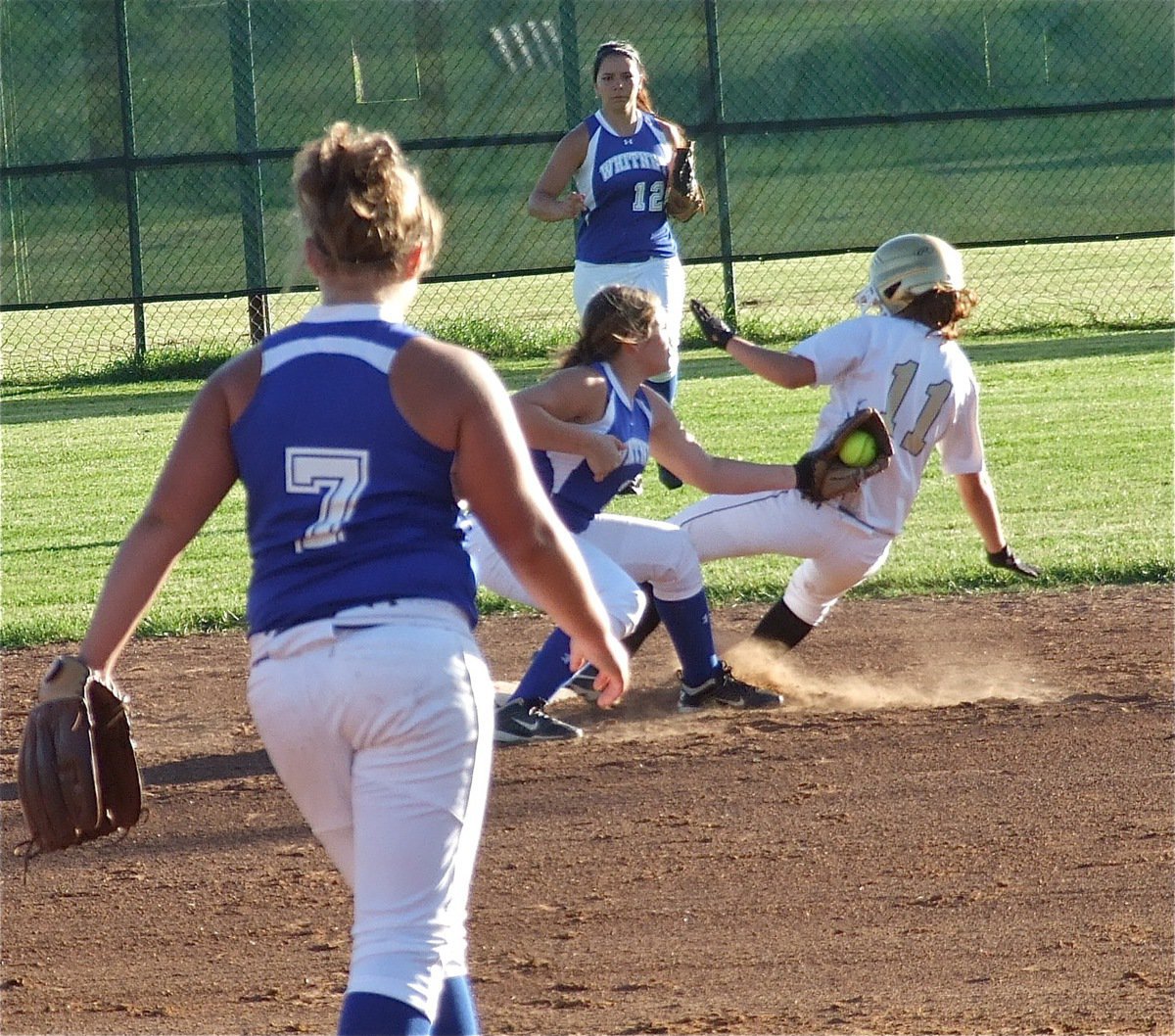 Image: Whitney manages to keep Italy’s Bailey Eubank(11) from stealing second.