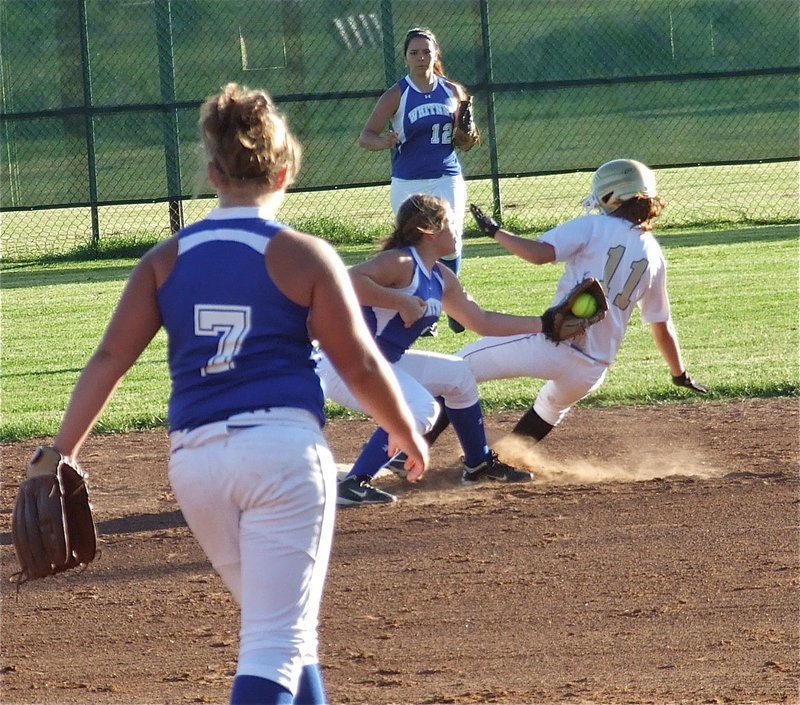 Image: Whitney manages to keep Italy’s Bailey Eubank(11) from stealing second.