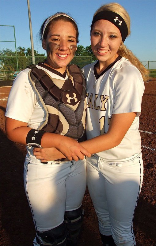 Image: The, “Sisters of Smash!” — Little sister, Alyssa Richards, a junior, gives her big sister, Megan Richards, a hug during Senior Day.