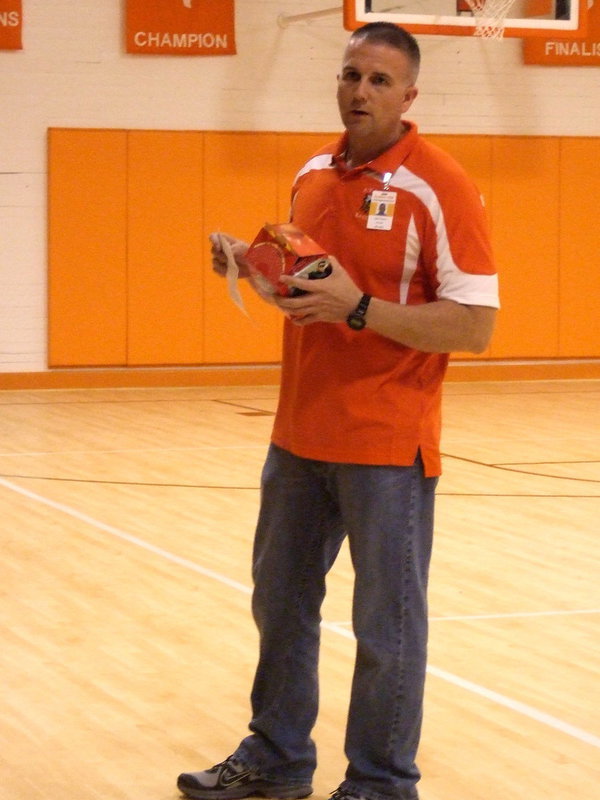 Image: Principal Tennery handing out awards.