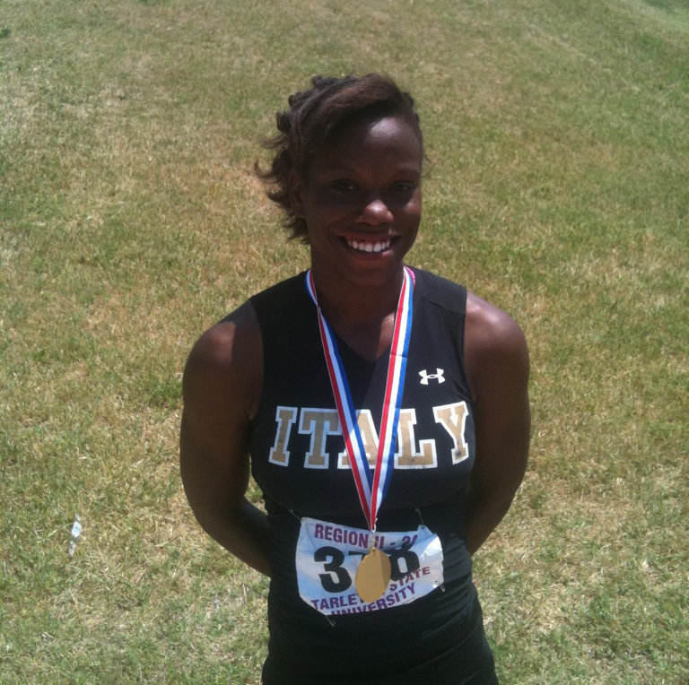 Image: Kortnei Johnson is #1 — After receiving her first place medal in the 100m dash in Stephenville at the regional track meet.