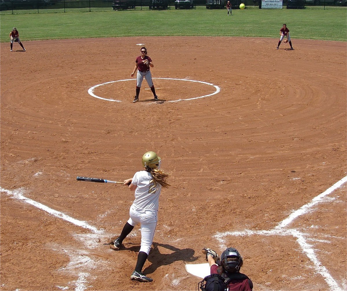 Image: Italy’s, Madison Washington(2), blasts a double into right field.