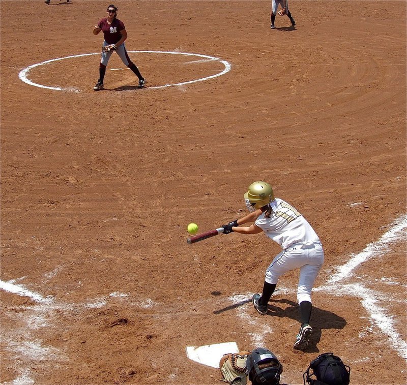 Image: Bailey Eubank(11) slaps the ball into play and sprints to first.