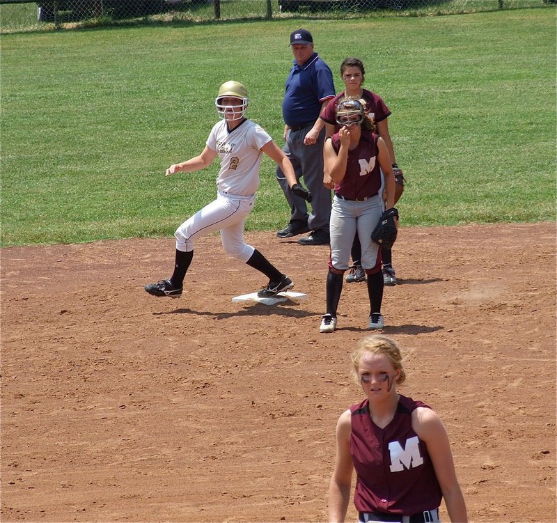 Image: Madison Washington(2) turns second and hopes for third.