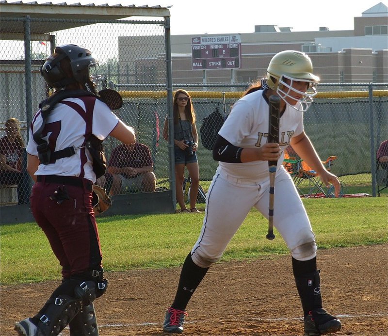 Image: In game 1 of the area championship, Mildred walks Lady Gladiator, Alyssa Richards(9), early in a show of respect for the homerun hitter.