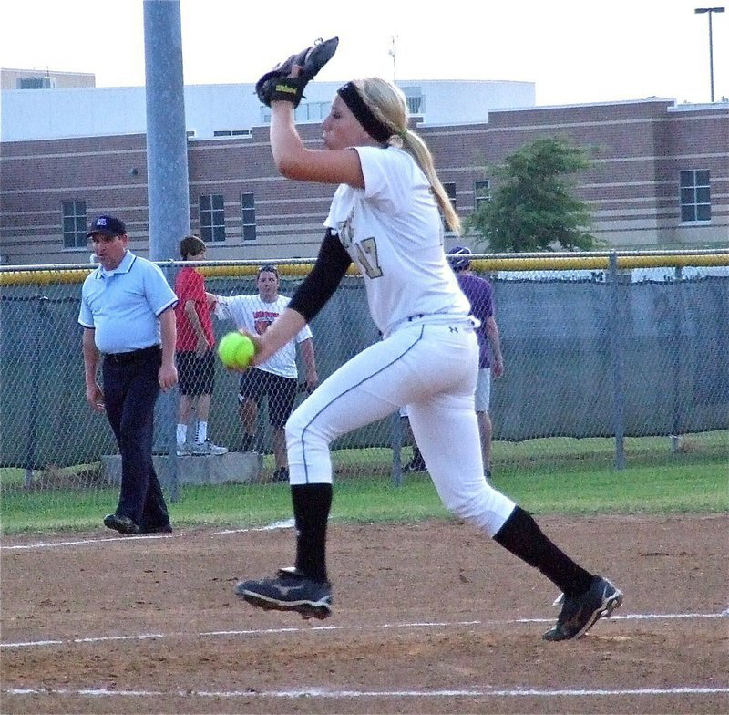 Image: Senior Lady Gladiator pitcher, Megan Richards(17) steps into her fast-pitch.