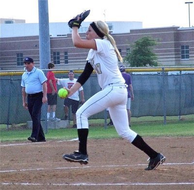 Image: Senior Lady Gladiator pitcher, Megan Richards(17) steps into her fast-pitch.