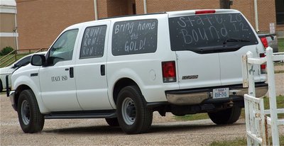 Image: And away they go! Kortnei Johnson, Jameka Copeland and Coach Hank Hollywood leave for the state track meet being held on the University of Texas campus.