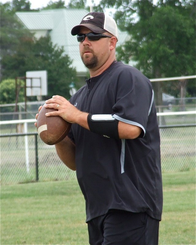 Image: Italy High School’s new athletic director and head football coach, Hank Hollywood, takes his players through the plays during spring practices.