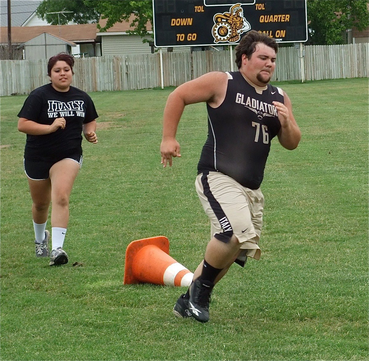 Image: Hank Seabolt and Monserrat Figueroa run a lap around Willis Field.