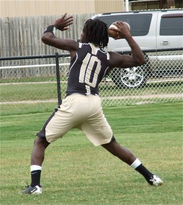 Image: Ryheem Walker drops back for a pass.