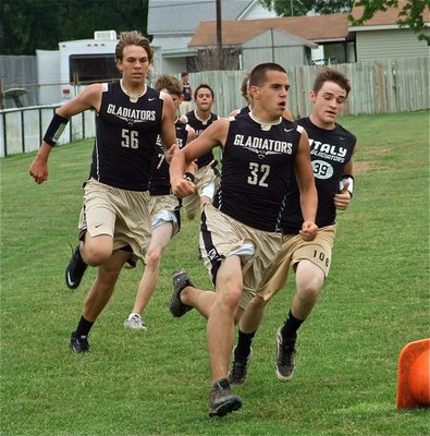 Image: This is like chariots of fire as Cody Medrano(32), Hayden Wood(39) and Cole Hopkins(56) try to turn the tide in Italy’s favor.