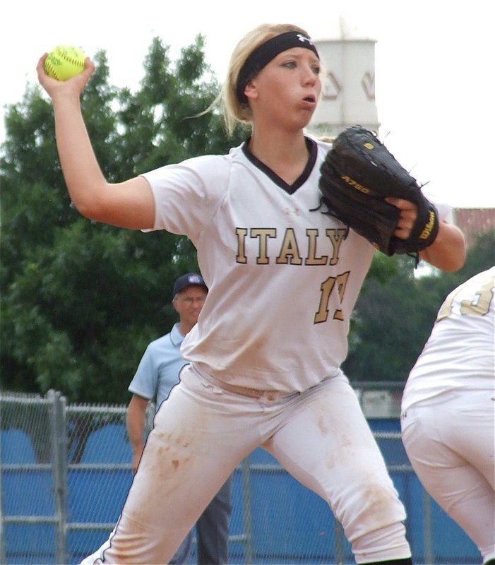 Image: Senior Lady Gladiator pitcher, Megan Richards(17), throws to first base for an out.