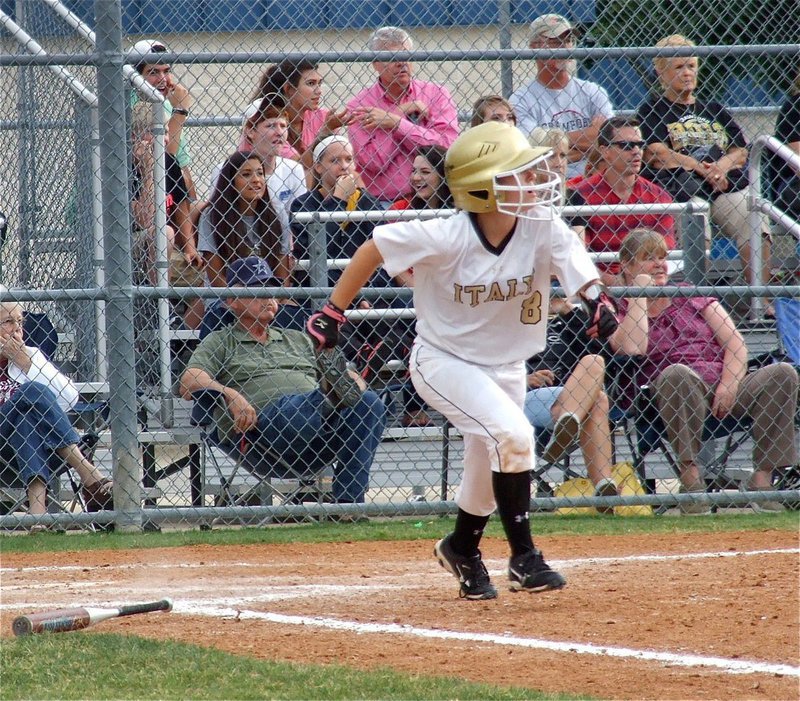 Image: Lady Gladiator, Tara Wallis(8), slap hits and then darts to first base.