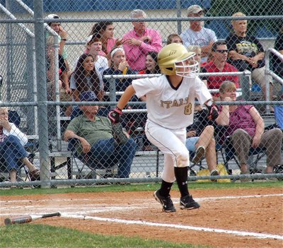 Image: Lady Gladiator, Tara Wallis(8), slap hits and then darts to first base.