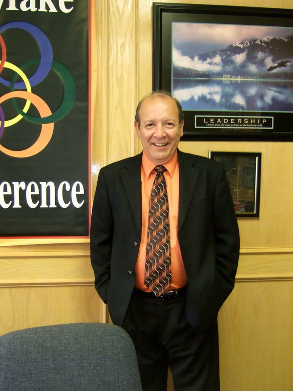 Image: Dr. DelBosque stands tall with pride over his student’s accomplishments